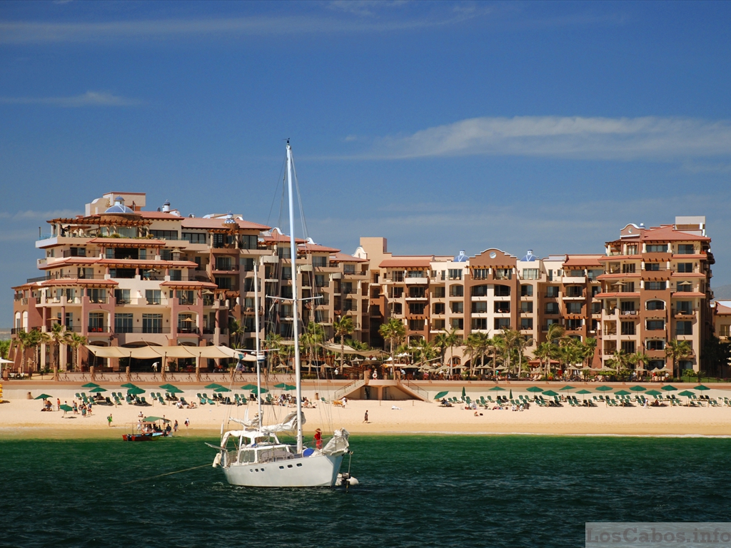 Sailboat Anchored in Front of A Beach Resort
